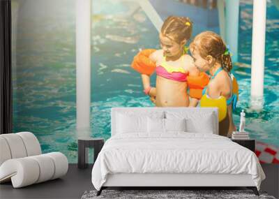 two little girls playing in the pool Wall mural