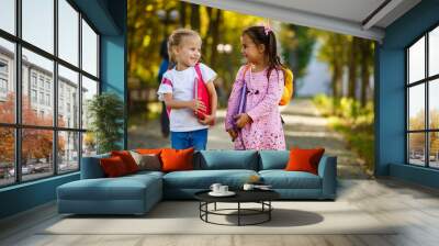 Two little kids going to school together Wall mural