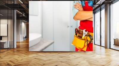 unknown handyman with hands on waist and tool belt with construction tools. tools and manual work concept Wall mural