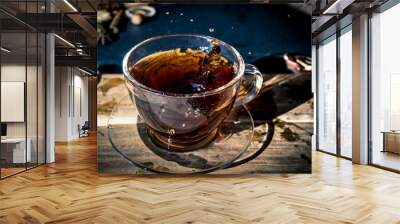 Cup of tea with splash Wall mural