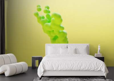 hand with floating green bubbles on yellow background Wall mural