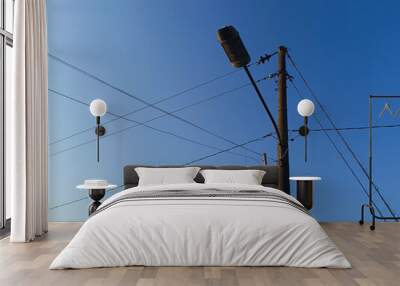 Power electric pole with line wire for residential buildings with blue sky background Wall mural