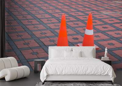 red safety cones on the red tile floor in the parking area in the morning Wall mural