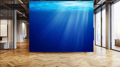 Abstract image of Tropical underwater dark blue deep ocean wide nature background with rays of sunlight. Wall mural