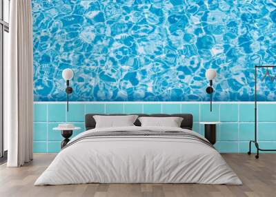 Blue tiles mosaic floor beside swimming pool from top view. Wall mural