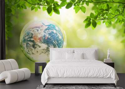 Ecology and Environment Concept : Blue planet earth in water bubble that floating in air with green natural in background. (Elements of this image furnished by NASA.) Wall mural