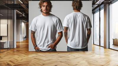 Young man in blank oversize t-shirt mockup front and back used as design template, isolated on white background Wall mural