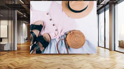 Summer holiday clothes. Female fashion outfit - skirt, top, hat, bag, sandals. Top view, flat lay Wall mural