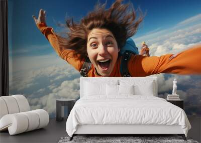 Young woman has fun skydiving in the sky Wall mural