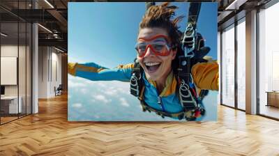 Young woman has fun skydiving in the sky Wall mural