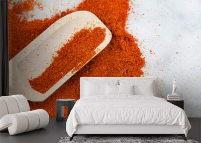 Cayenne pepper powder with wooden scoop and copy space Wall mural