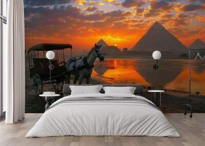 A horse is pulling a carriage on a beach near the pyramids Wall mural