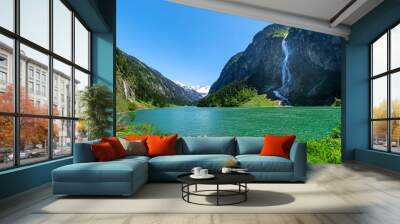 Mountain landscape with clear turquoise lake and waterfall in the Alps. Zillertal Alps Nature Park, Austria, Tyrol. Wall mural