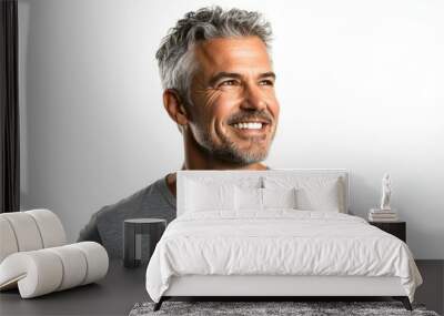 Confident middle aged man smiling in casual attire. Wall mural