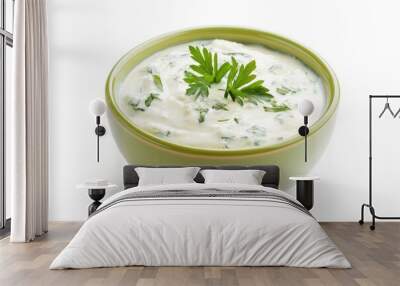 Green bowl of sour cream dip sauce with herbs isolated on white background  top view Wall mural