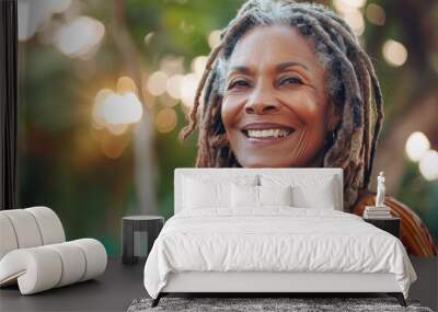 Happy senior woman with dreadlocks outdoors in casual attire. Wall mural