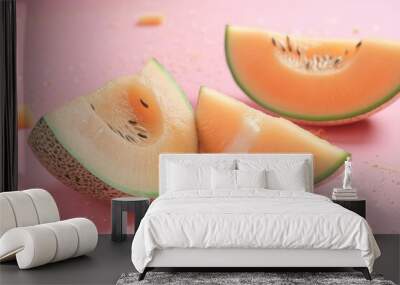 Melon and pieces on a pink background Wall mural