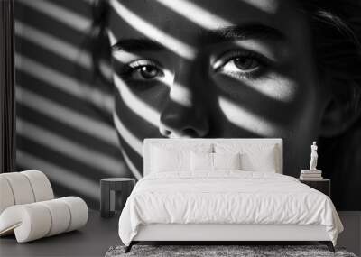 Striped shadow pattern on beautiful woman in black and white. Wall mural