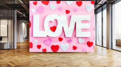 The word love in white letters on pink background. Wall mural