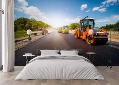 industrial landscape with rollers that rolls a new asphalt in the roadway. repair, complicated trans Wall mural