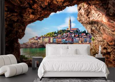 Unusual view with old clock towe in Piran through a rock hole. the tourist center of Slovenia. popular tourist attraction. Wonderful exciting places. Wall mural