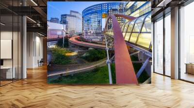 Sunset and Illuminated bridge linking two building together at La Defense, the European largest business district located in West of Paris, France Wall mural