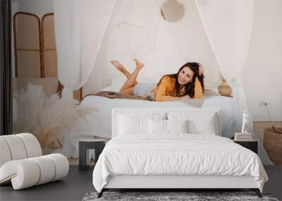 smiling woman awake after healthy sleep lying in cozy comfortable bed enjoy good morning Wall mural