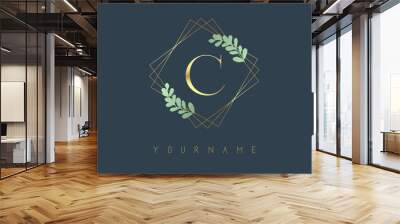 Golden Letter C Logo With golden square frames and green leaf design. Creative vector illustration with letter C. Wall mural