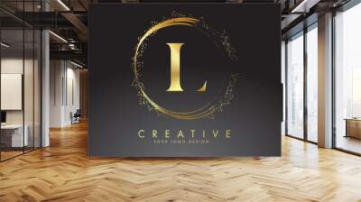 L golden letter logo with golden sparkling rings and dust glitter on a black background. Luxury decorative shiny vector illustration. Wall mural