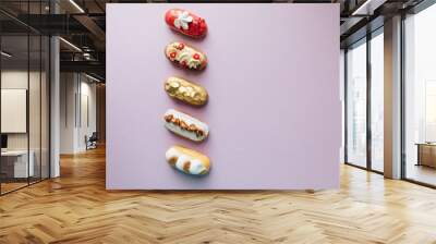 assorted delicious sweets on purple background Wall mural