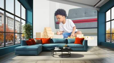 African boy playing in living room at home Wall mural