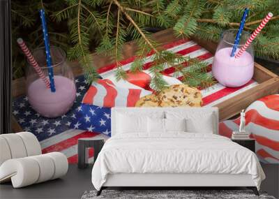 Celebration of Independence Day. Cookies and cocktails on a USA flag tray and spruce branches in the garden.
 Wall mural