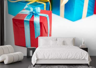 Gift boxes with ribbons and christmas decor isolated on white background. Happy birthday colorful gifts Wall mural