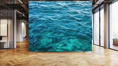  a boat floating on top of a large body of water next to a shore covered in green algae covered rocks and a blue ocean with a boat in the distance.  generative ai Wall mural