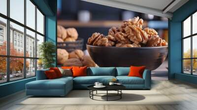   A bowl of walnuts sits on a table next to two bowls of walnuts Wall mural