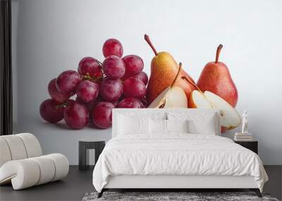   A group of grapes and apples arranged on a white surface, with an apple sliced in two Wall mural