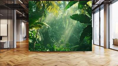   A lush forest with abundant green flora and ample sunlight filtering through the tree leaves along the roadside Wall mural