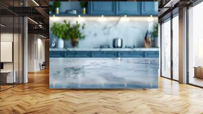  A marble kitchen countertop in front of a blue kitchen set, showcasing the elegant stone texture and the stylish contrast with the blue cabinetry. Wall mural