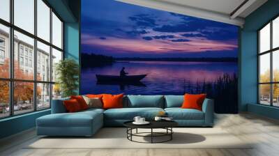   A person in a boat on a body of water under a purple and blue night sky Wall mural