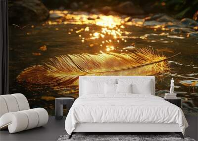   Golden feather bobbing atop flowing river, near pebbled shore and rippling current Wall mural