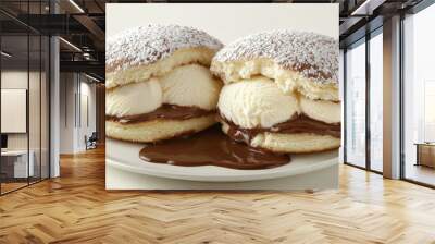   Two ice cream sandwiches on a plate with chocolate sauce and powdered sugar on top Wall mural