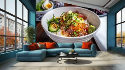 a bowl of fresh poke with rice, salmon, avocado, green onions, and sesame seeds, garnished with wasa Wall mural