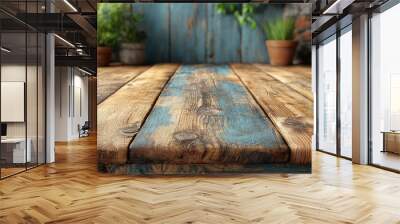 A rustic wooden table with a rich, weathered texture in shades of brown and blue is displayed in a cozy indoor space adorned with potted plants, creating a tranquil garden ambiance Wall mural