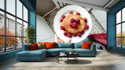 Delicious whole wheat healthy pancakes with raspberry, fork and knife styling natural light and copy space on the table with linen cloth background lifestyle Wall mural