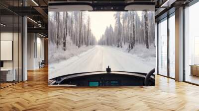 An unmanned vehicle equipped with artificial intelligence is driving on a winter road. View from the car interior to the road. Wall mural