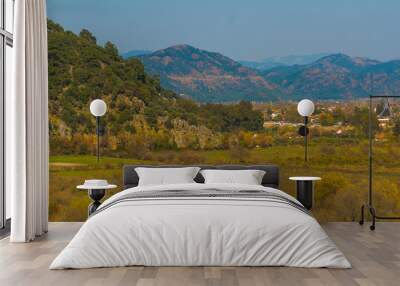 DALYAN, TURKEY: Landscape with a view of the road, mountains and the town of Dalyan on a sunny day. Wall mural