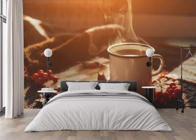 Autumn hot steaming cup of coffee or tea. Wall mural