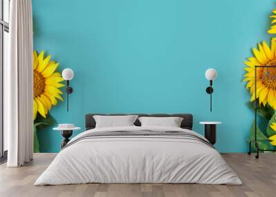 beautiful sunflowers on blue background. view from above. background with copy space. Wall mural