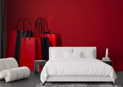 Black Friday with red shopping bags, copy space Wall mural