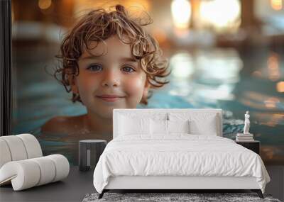 Child enjoying time in the pool. Cute boy having fun on vacation at the hotel pool  Wall mural